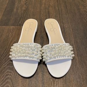White slides with pearl/sequin detail.